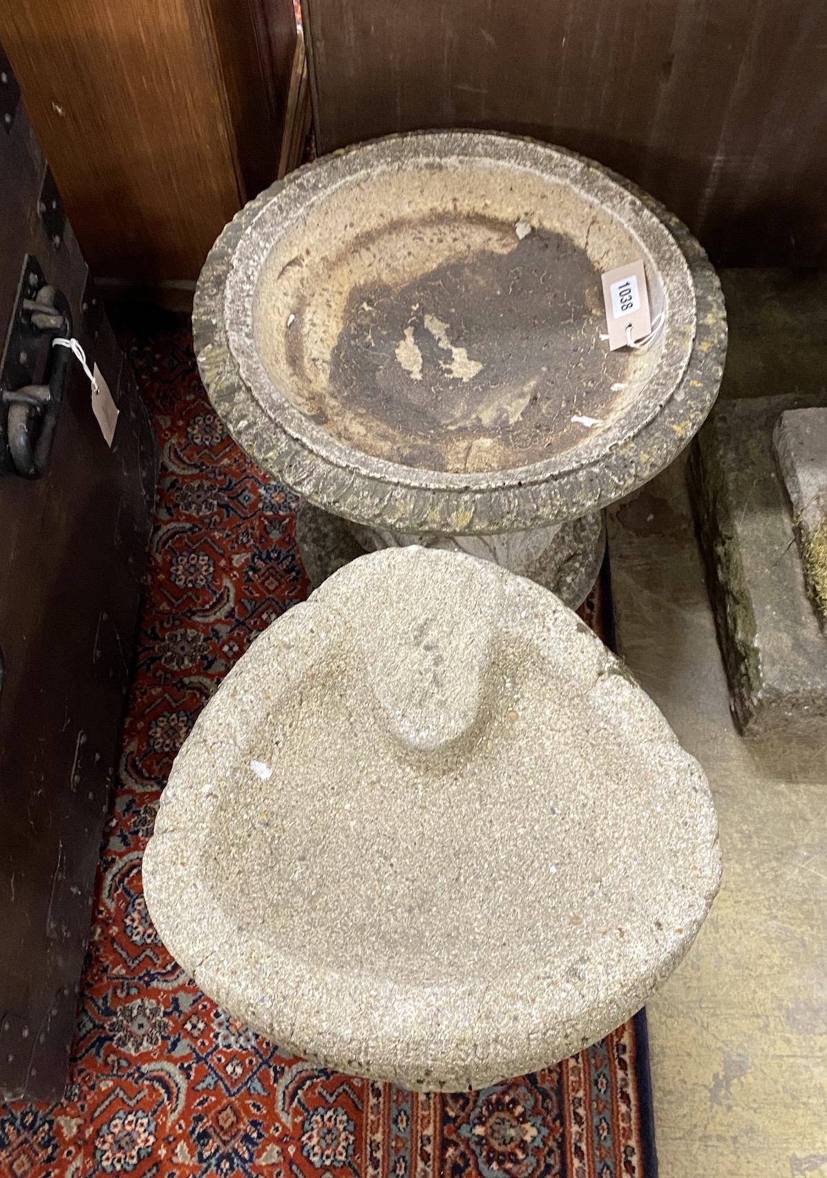 Two reconstituted stone bird baths, larger diameter 47cm and height 36cm